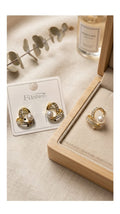 Love shaped pearl earring